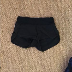Lightly worn black athletic shorts